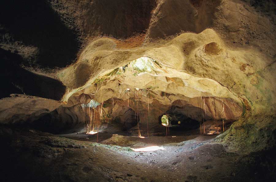 interior of cave system with rays of sun light