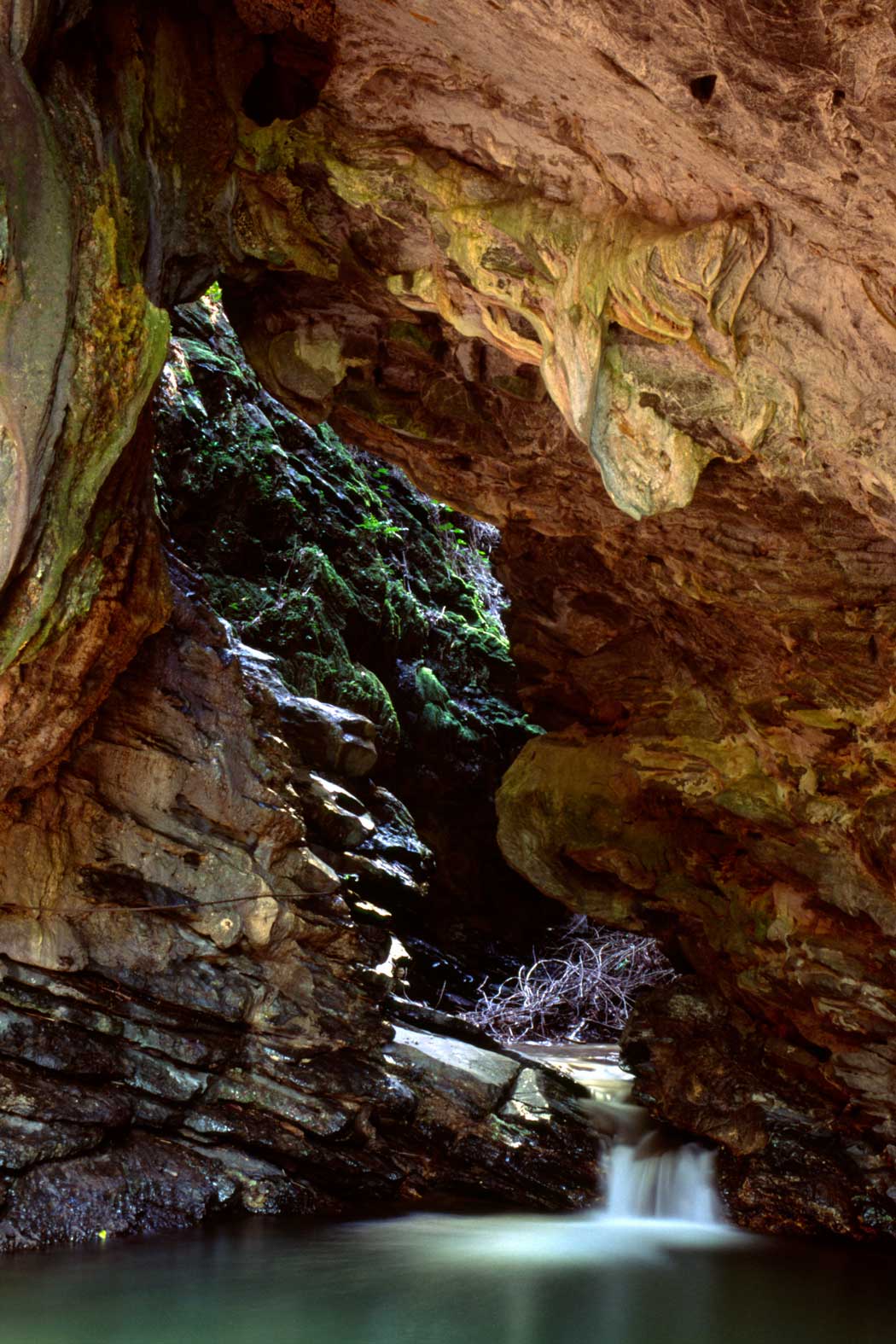 Gruta La Batata cave at Topes de Collantes – Photo: Alamy inside a cave with water flowing to a lagoon