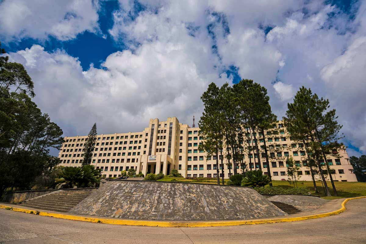 Escambray Spa Hotel, Topes De Collantes – Photo: Alamy large hotel building with pine trees in front