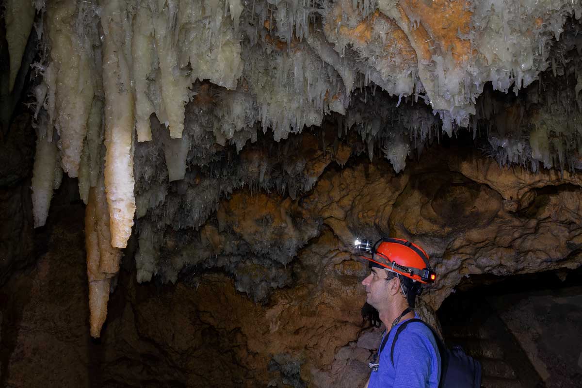 Man exploring Cuevas de Bellamar, Matanzas – Photo: Shutterstock