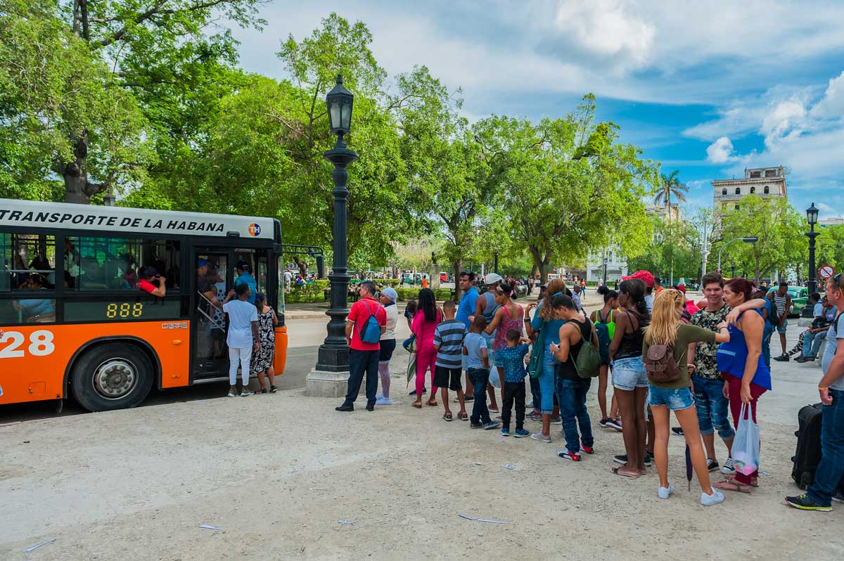 People waiting in line for a public bus, Havana – Photo: Shutterstock